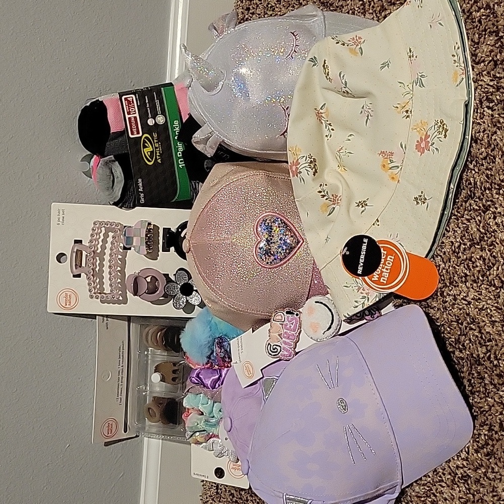 Girls bundle. 5 hats. 2 sets of clips. 8 hair twisters. 10 pr socks. New